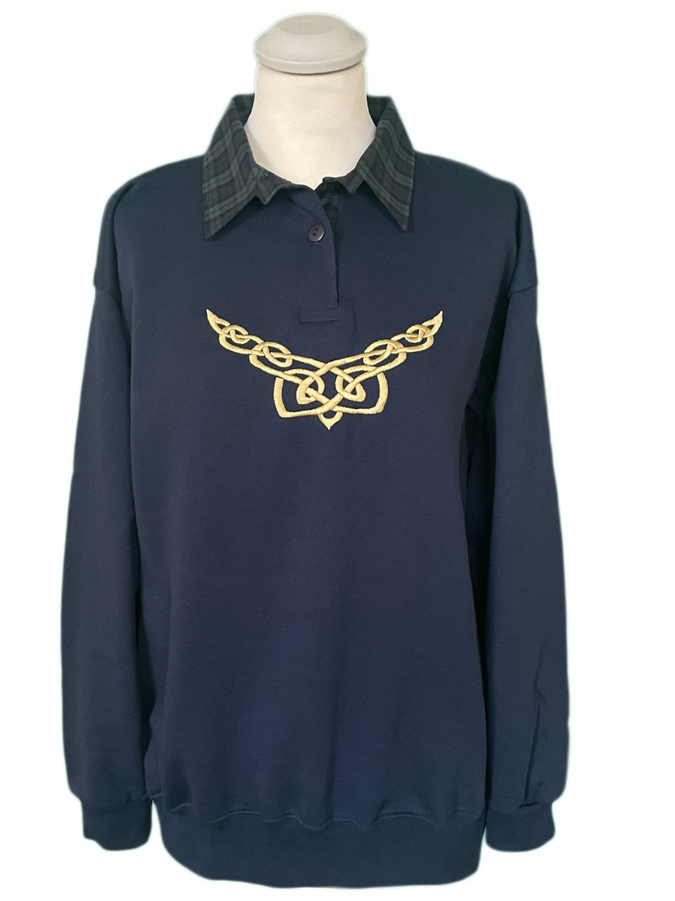 navy jumper with a tartan collar with the celtick knot embroidered on the front of the jumper