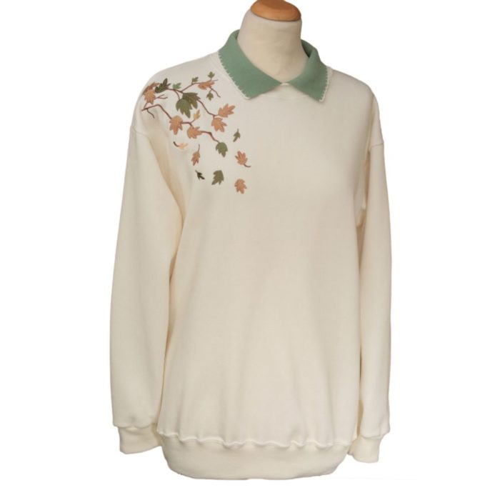 Ladies cream sweatshirt with knitted collar with autumnal leaves pattern on shoulder