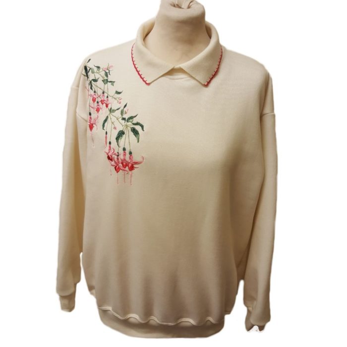 Ladies cream sweatshirt with knitted collar with floral pattern on shoulder