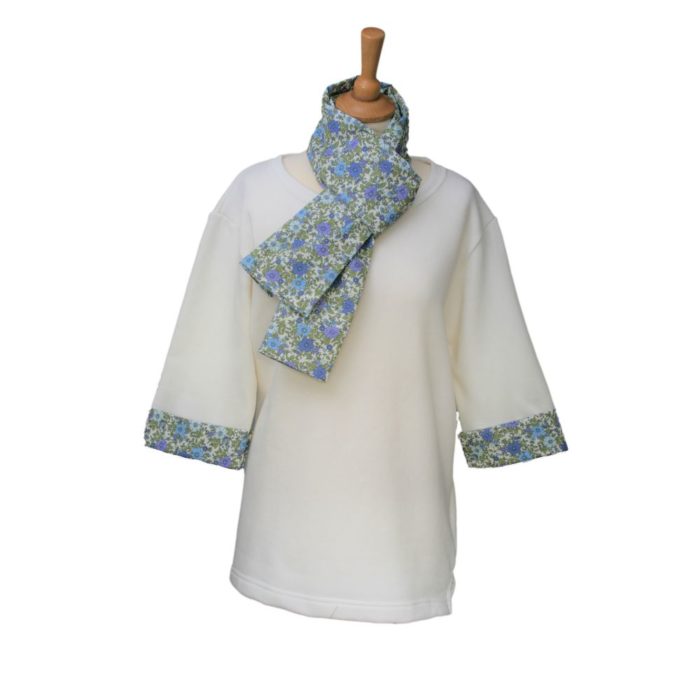 Ladies cream tunic with floral patterned scarf and cuffs