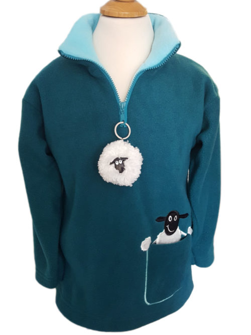blue fleece for children with a sheep on the side and a sheep keyring on the zip