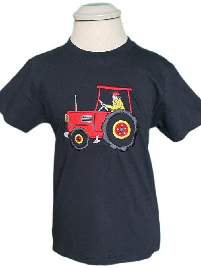 A child's dark navy t-shirt with a cute red tractor design in the middle.