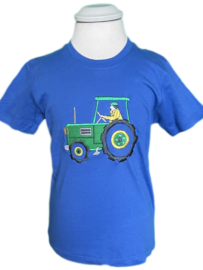 A child's blue t-shirt with a cute green tractor design on it.