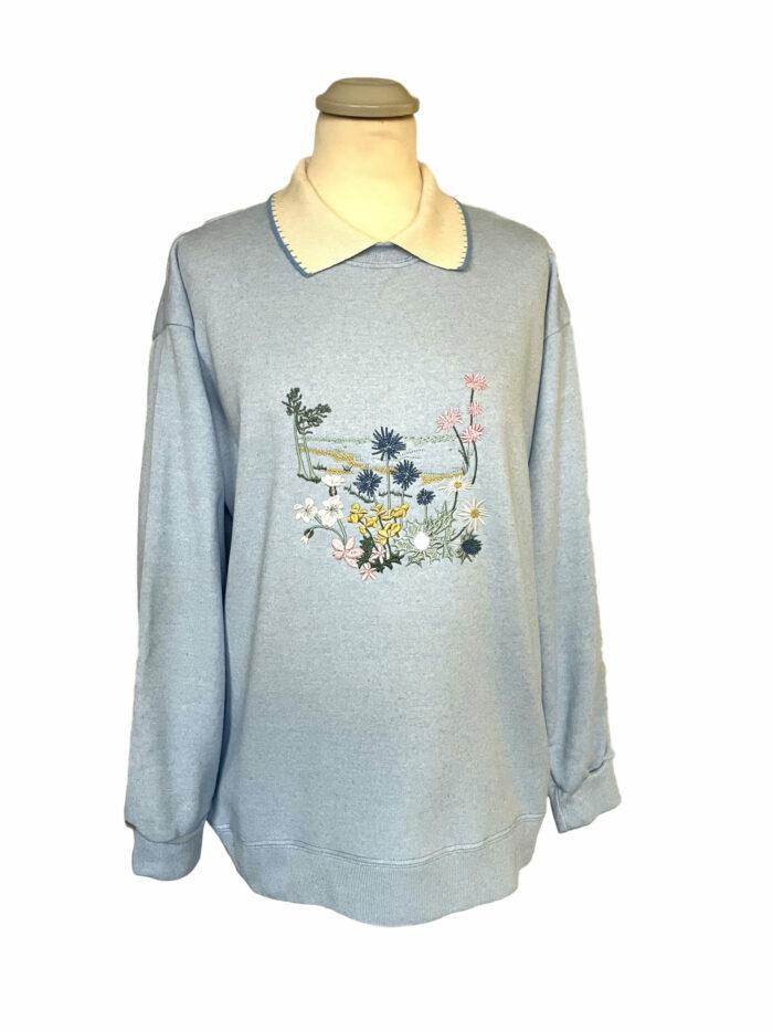 Ladies light blue collared sweatshirt with coastal floral pattern